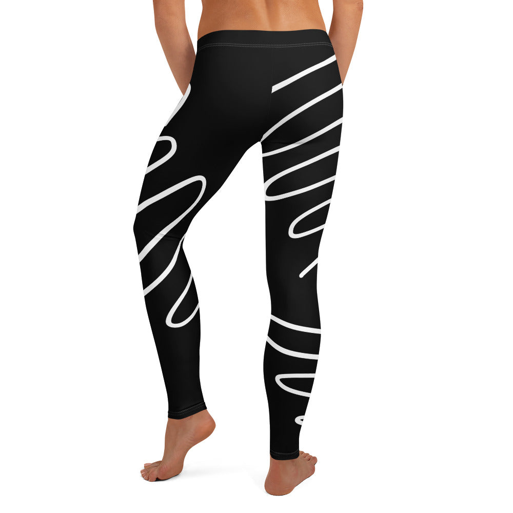 Legging noir à motifs blancs sur toute la jambe, coupe près du corps.