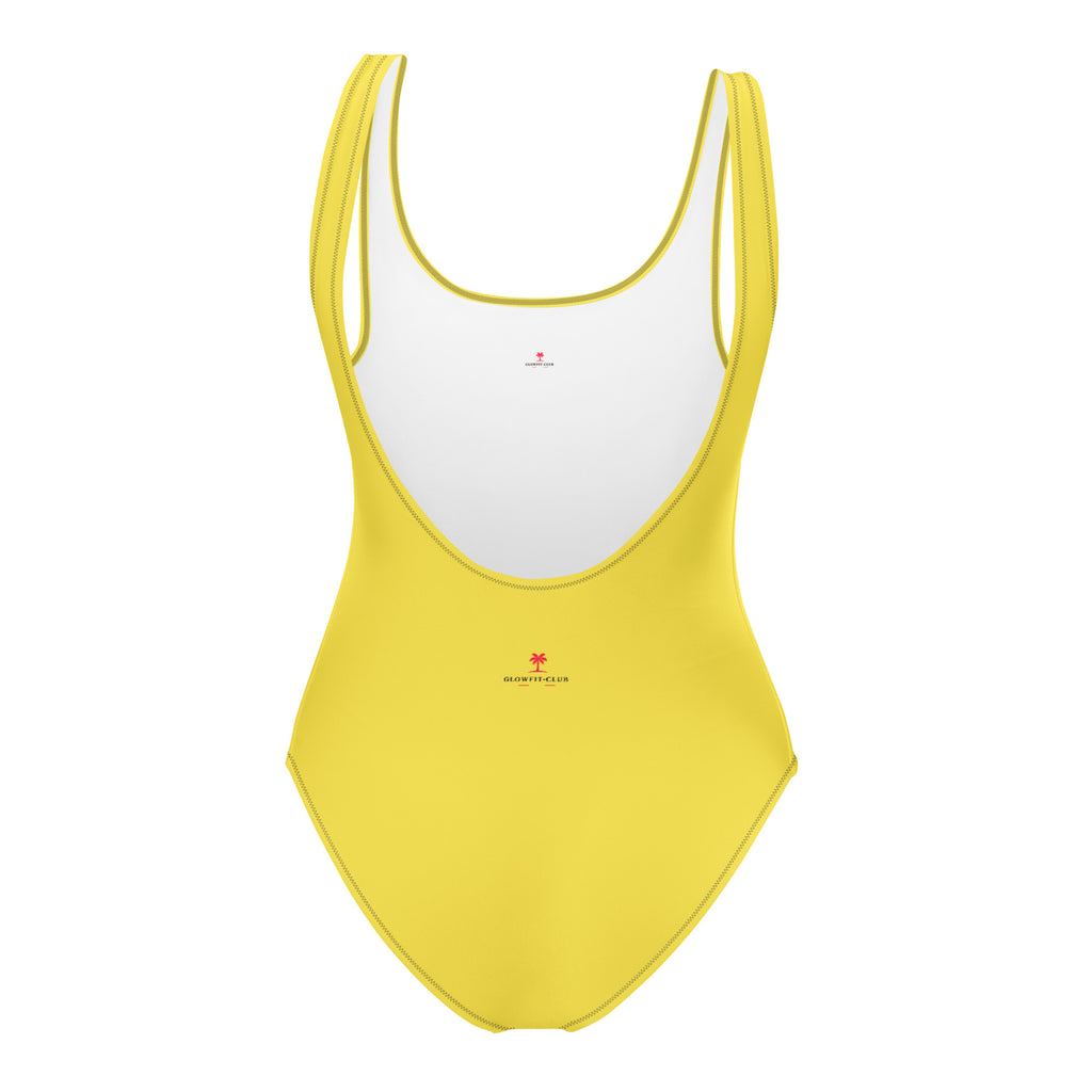 Maillot de bain 1 pièce jaune, encolure arrondie, motifs discrets rouges.