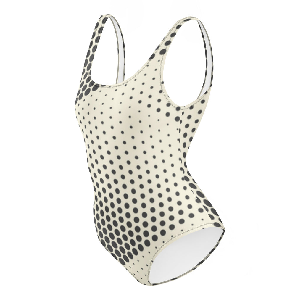 Maillot de bain une pièce à pois noirs, dos et côtés échancrés, bretelles réglables