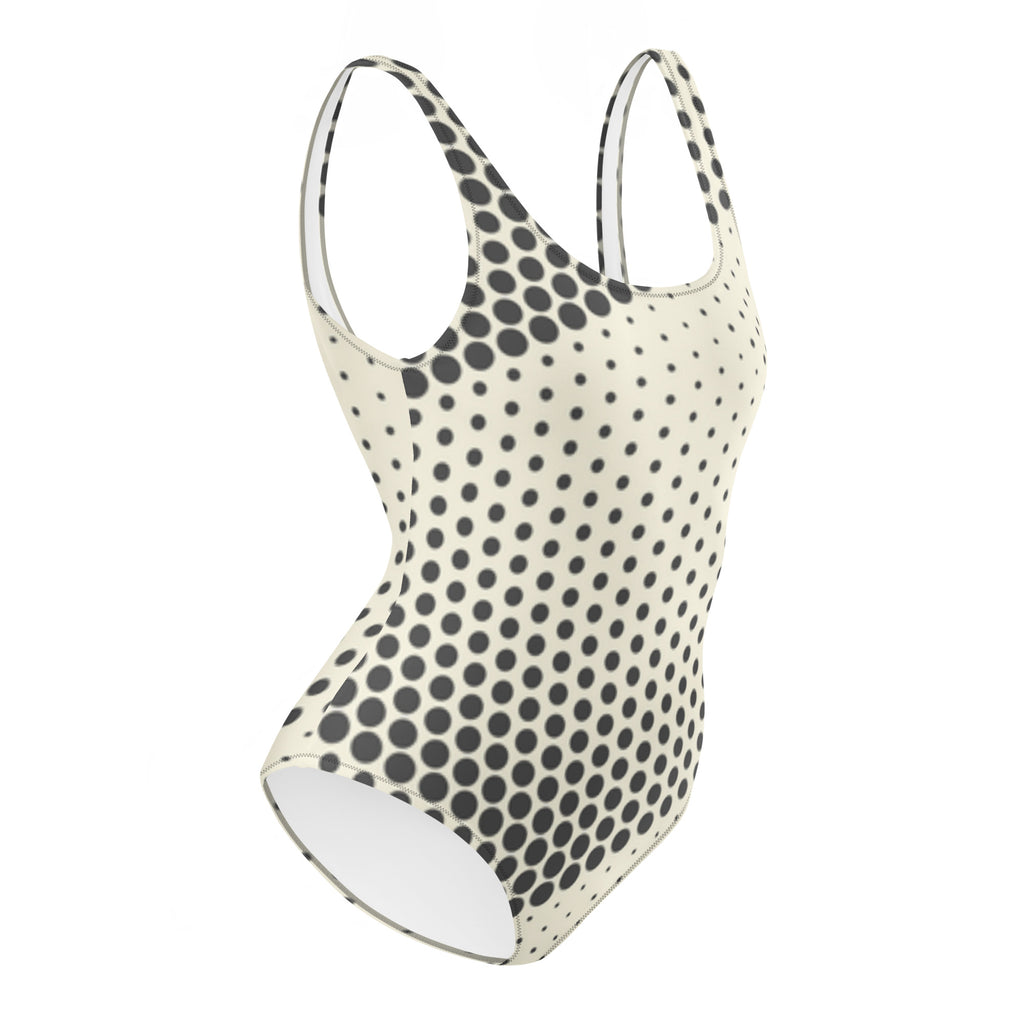 Maillot de bain une pièce à pois noirs, vue de côté, encolure ronde et jambes échancrées