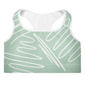Brassière de sport rembourrée vert menthe, tissu motif abstrait blanc.