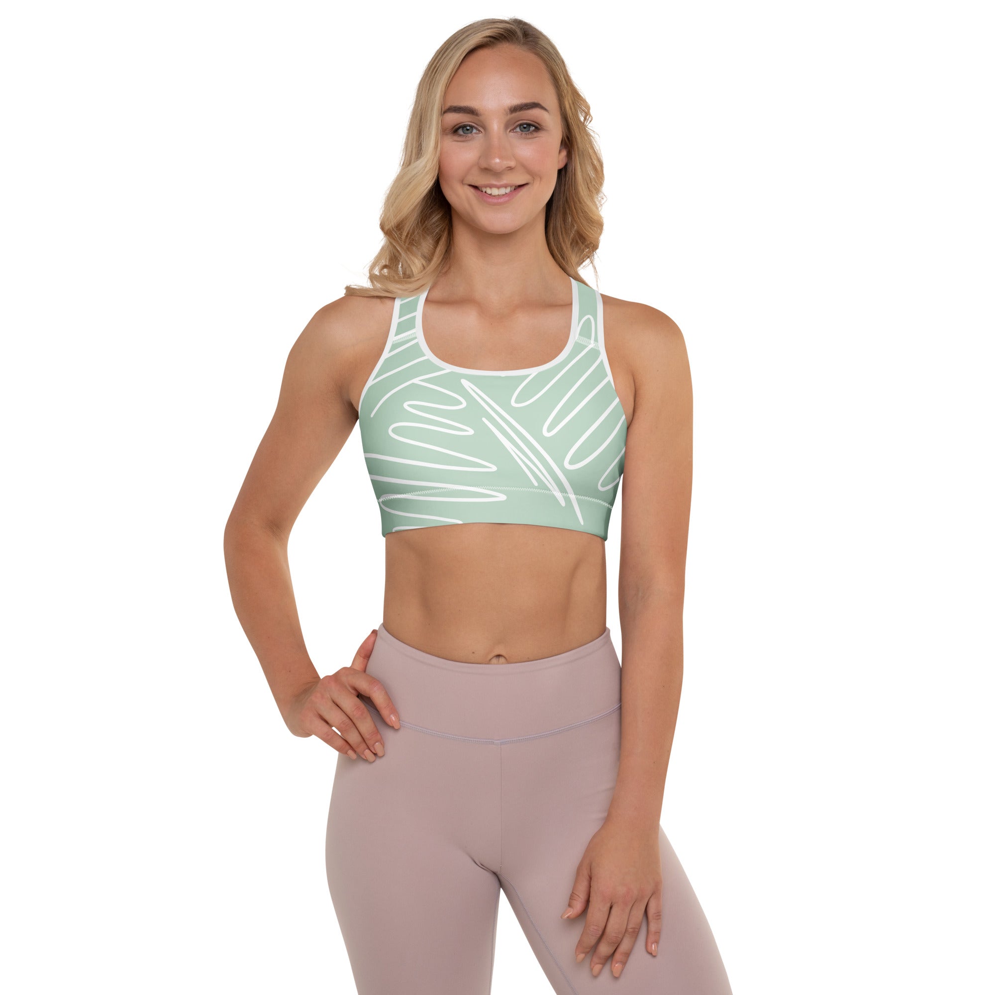 Brassière de sport rembourrée vert menthe, motif blanc, encolure arrondie.