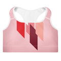 Brassière de sport rembourrée rose à empiècements rouge et noir, bords blancs