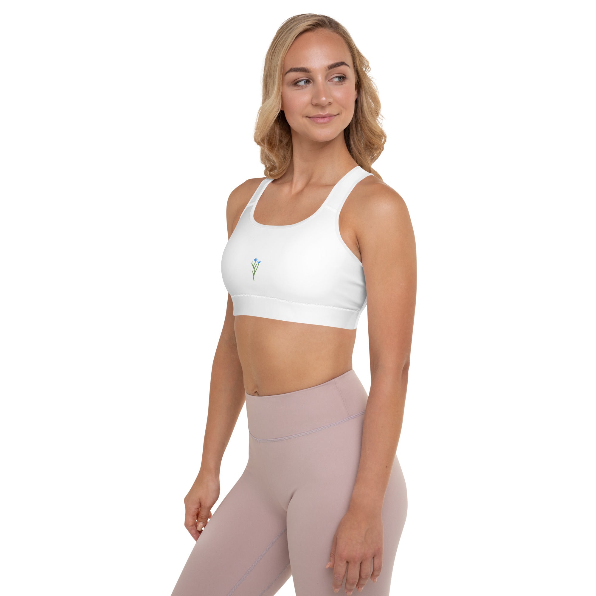Brassière de sport blanche rembourrée, bretelles larges, vue de profil avec logo.