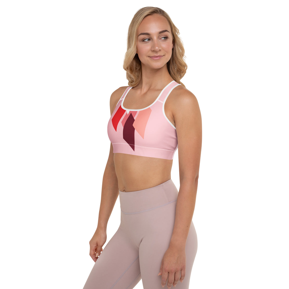 Brassière de sport rembourrée rose avec motif rouge/noir, dos nageur et bords blancs
