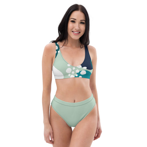 Bikini femme de face : haut imprimé bulles vert menthe, bretelles bleu marine, culotte assortie.