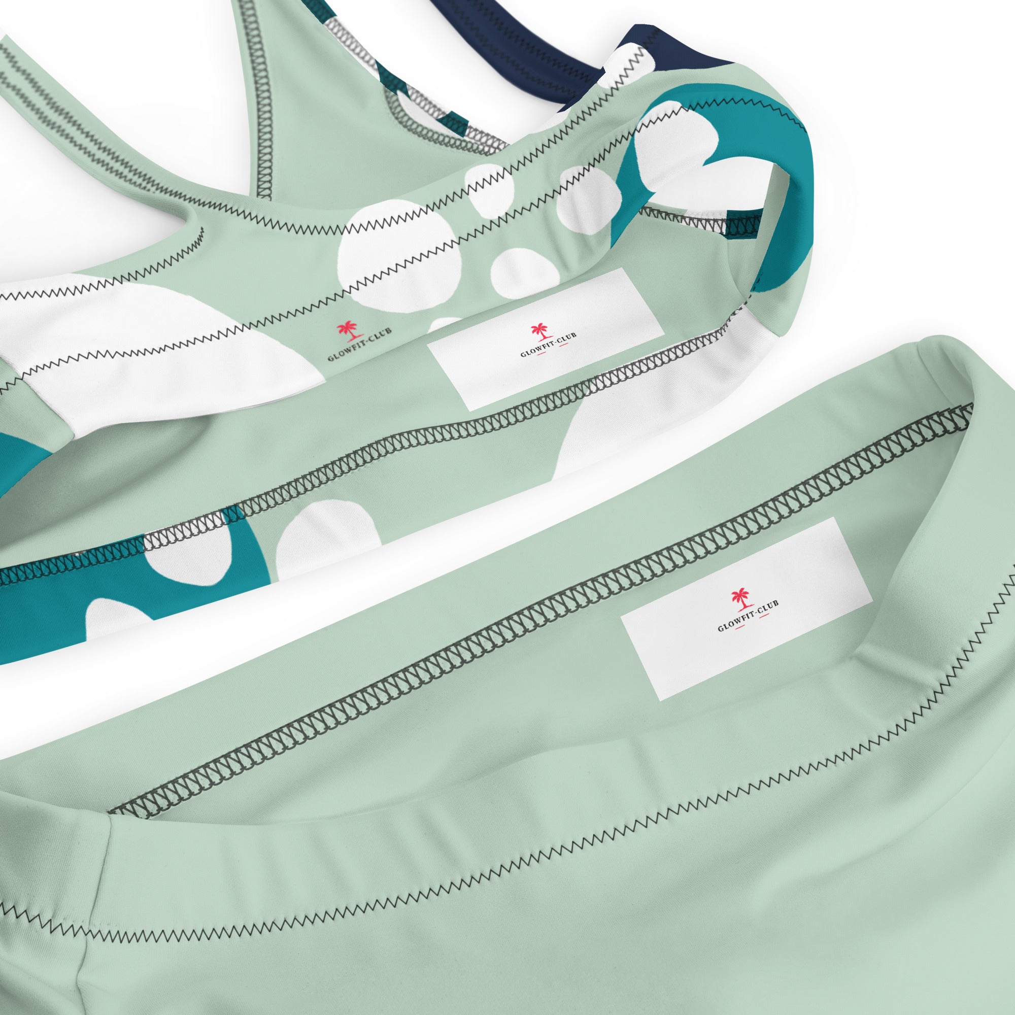 Haut de bikini imprimé bulles : empiècements vert menthe, touches bleu marine, coutures décoratives.