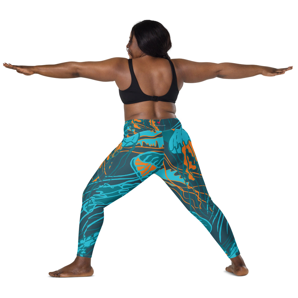 Legging taille haute imprimé bleu turquoise à motifs abstraits, vue arrière en mouvement.