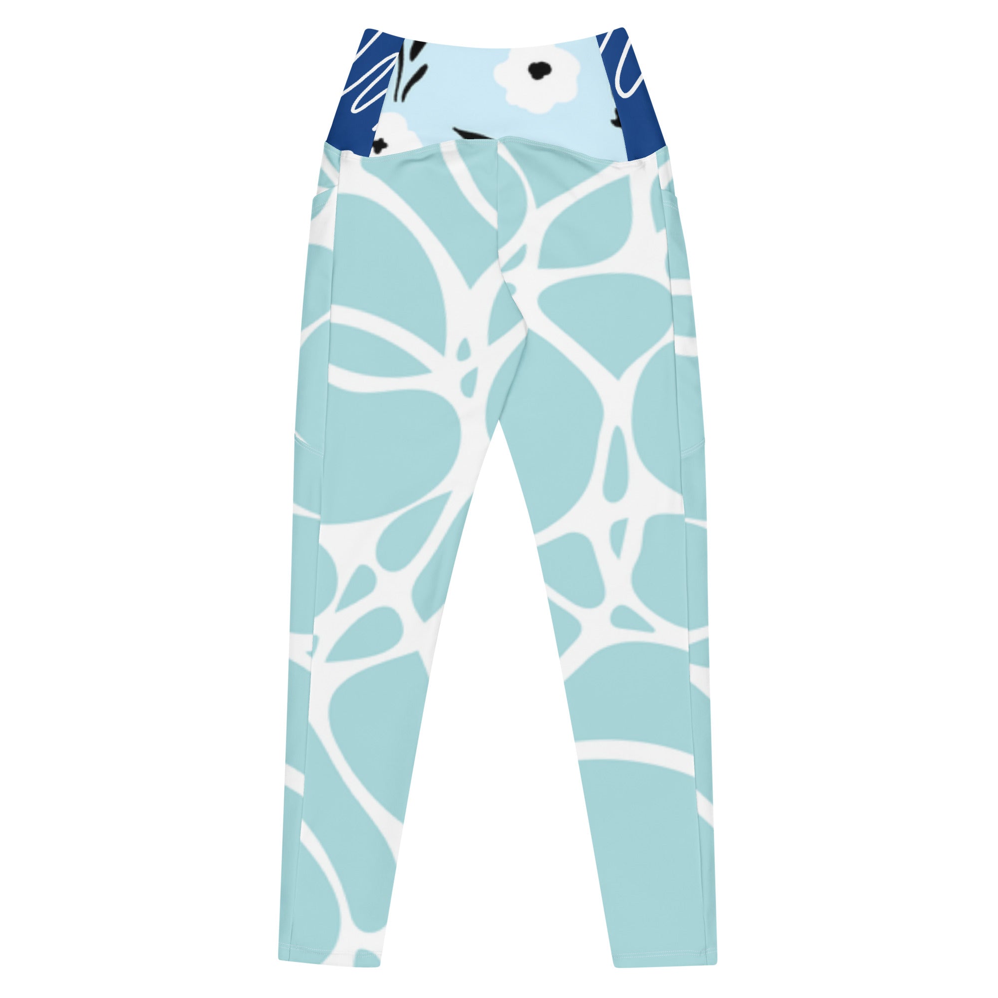 Leggings aqua motif feuilles blanches, bord bleu marine en haut, coupe près du corps.