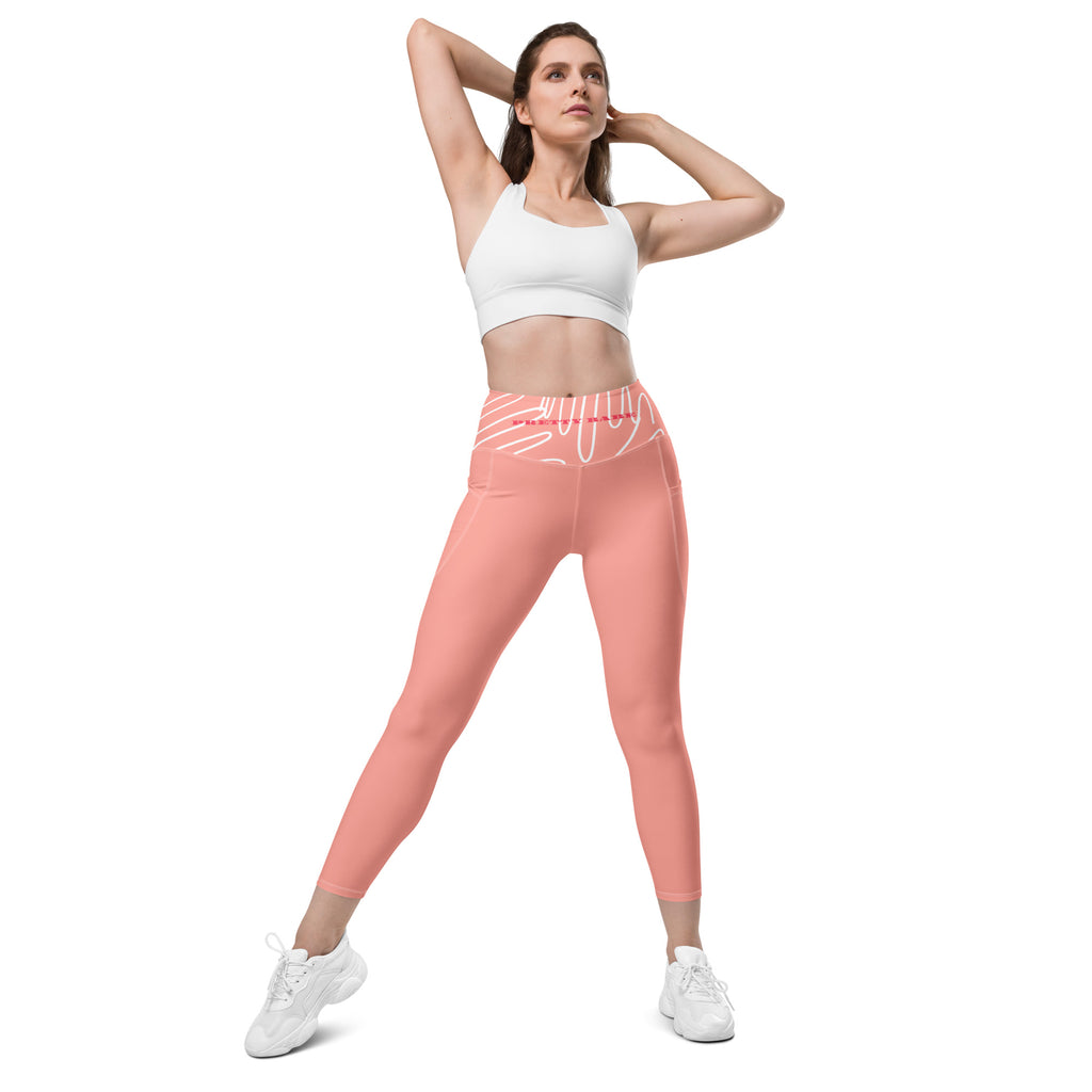 Leggings rose 7/8, taille élastique et poches latérales, porté en mouvement