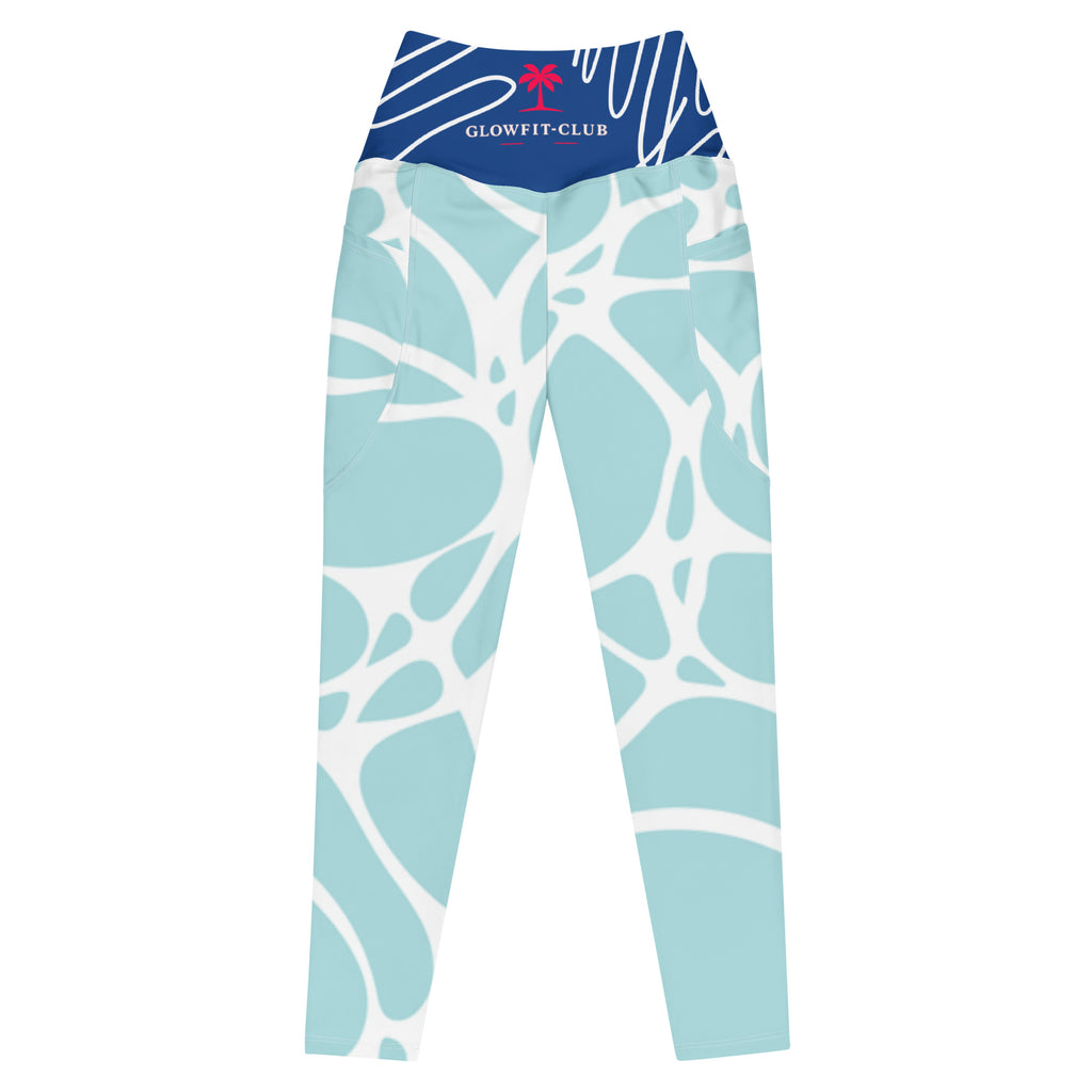 Leggings taille haute aqua motif feuilles blanches, ceinture bleu marine, tissu extensible.