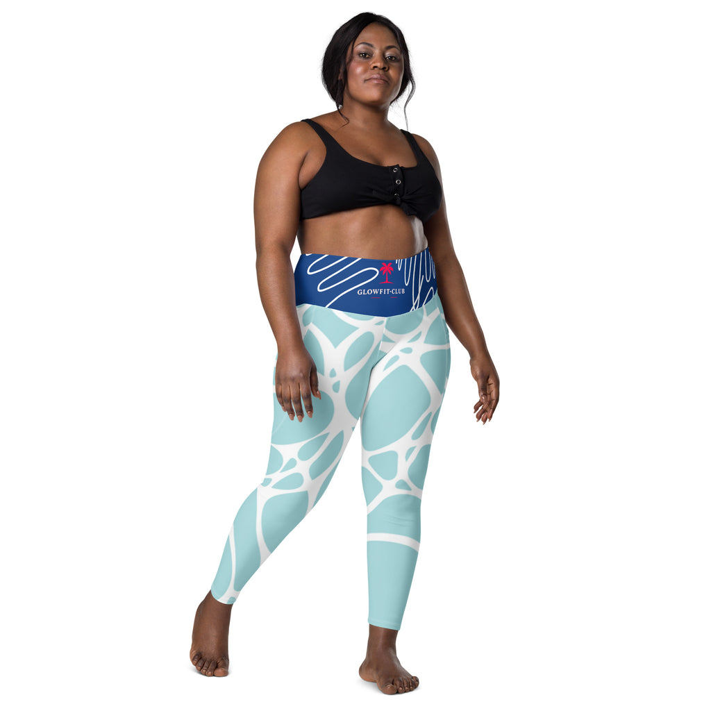 Leggings aqua bleu à poches, motif abstrait blanc, vue de face sur jambes et taille