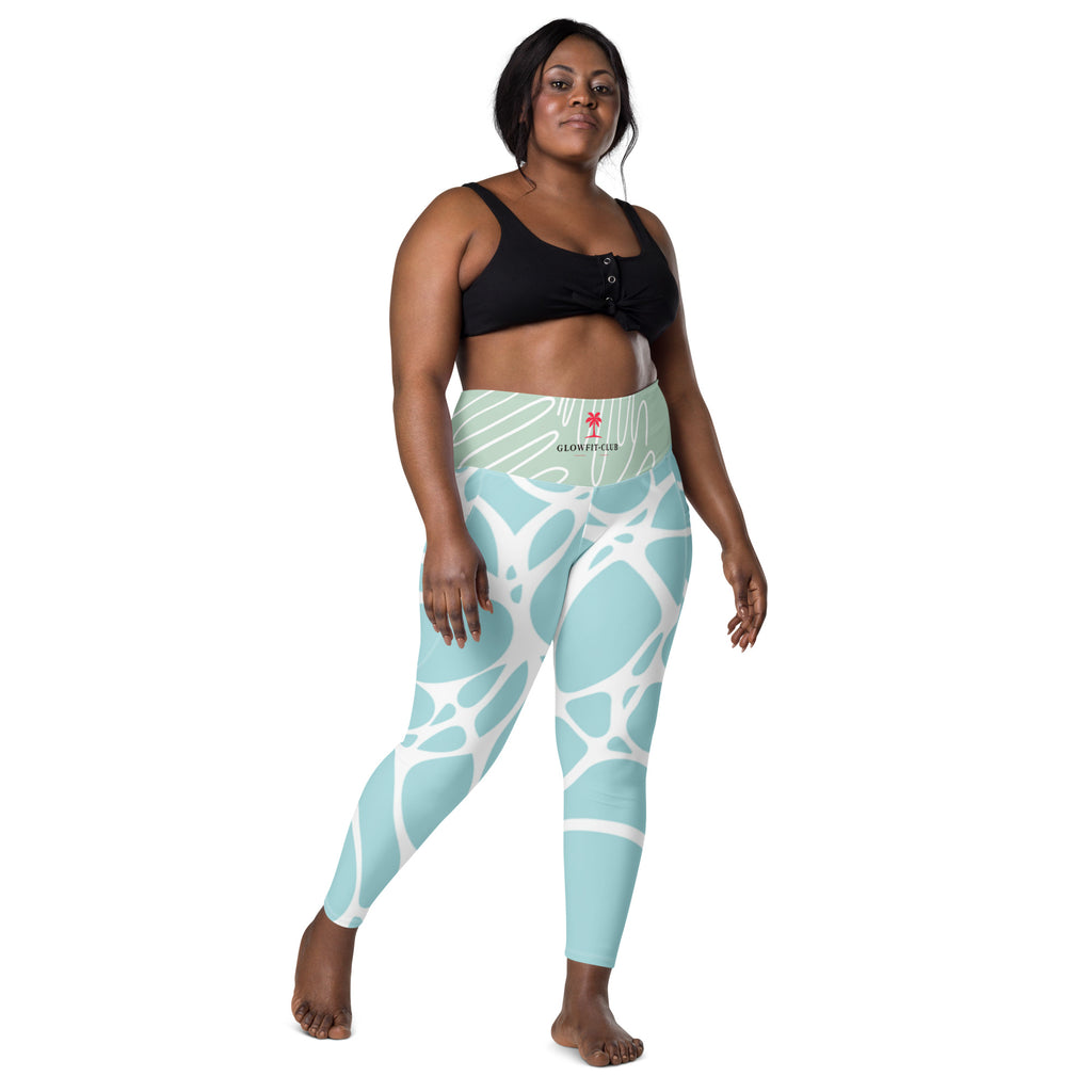 Leggings turquoise à motif blanc et poches, vue avant pleine longueur.
