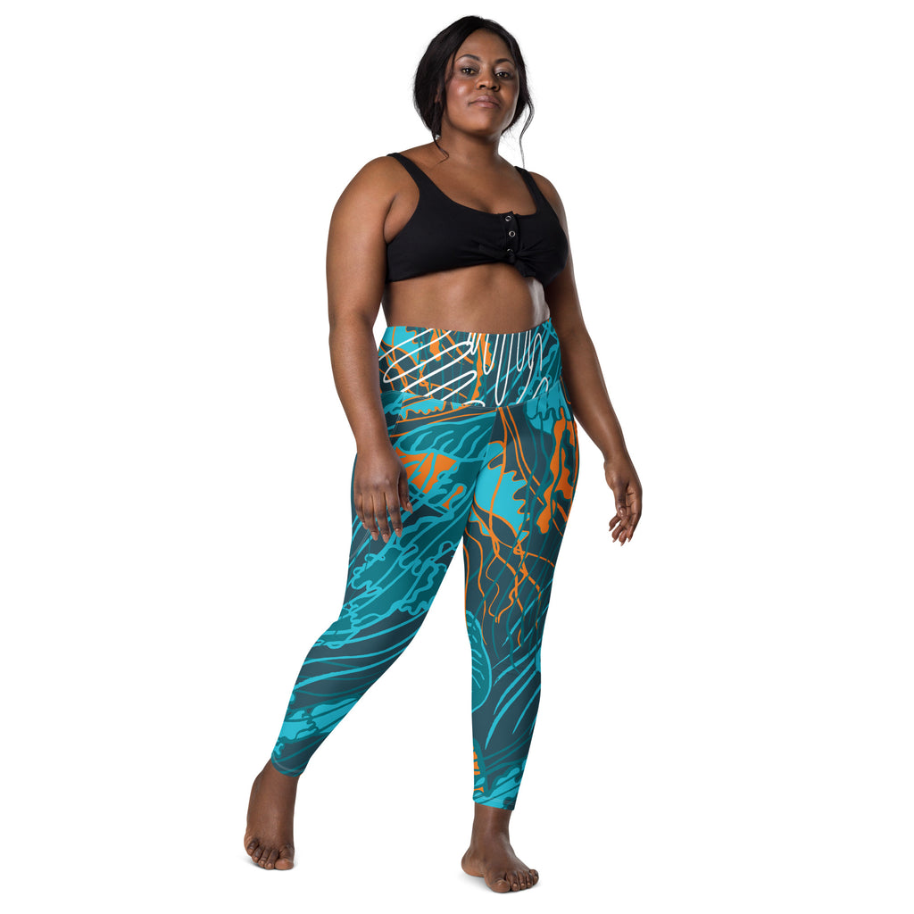 Legging taille haute imprimé bleu turquoise et orange, vue de face debout.