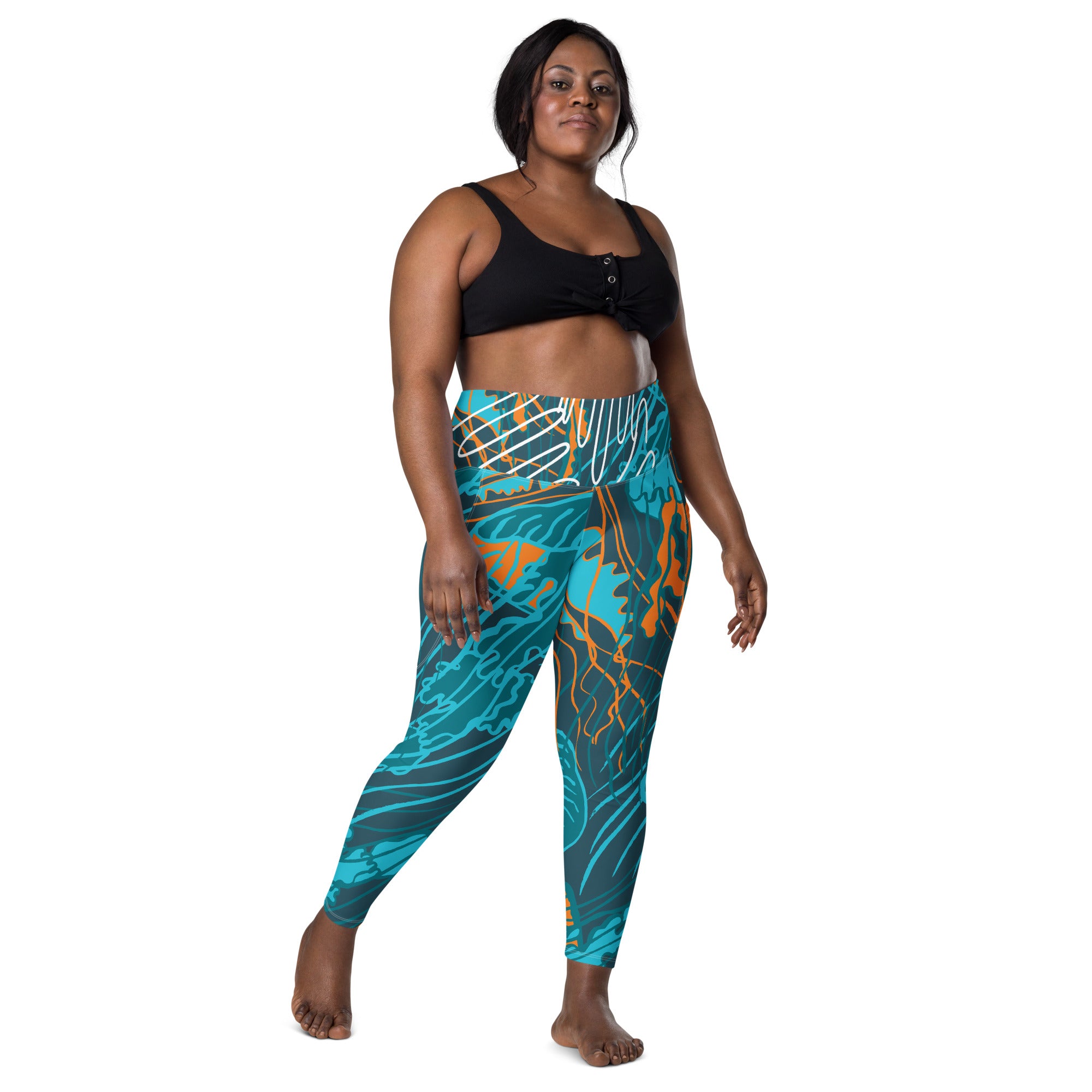 Legging taille haute imprimé bleu turquoise et orange, vue de face debout.
