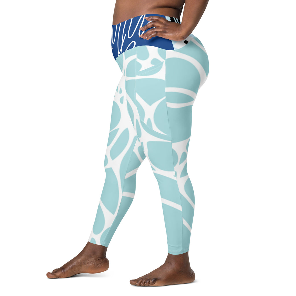 Leggings aqua bleu à poches, gros plan dos, motif abstrait blanc sur jambes