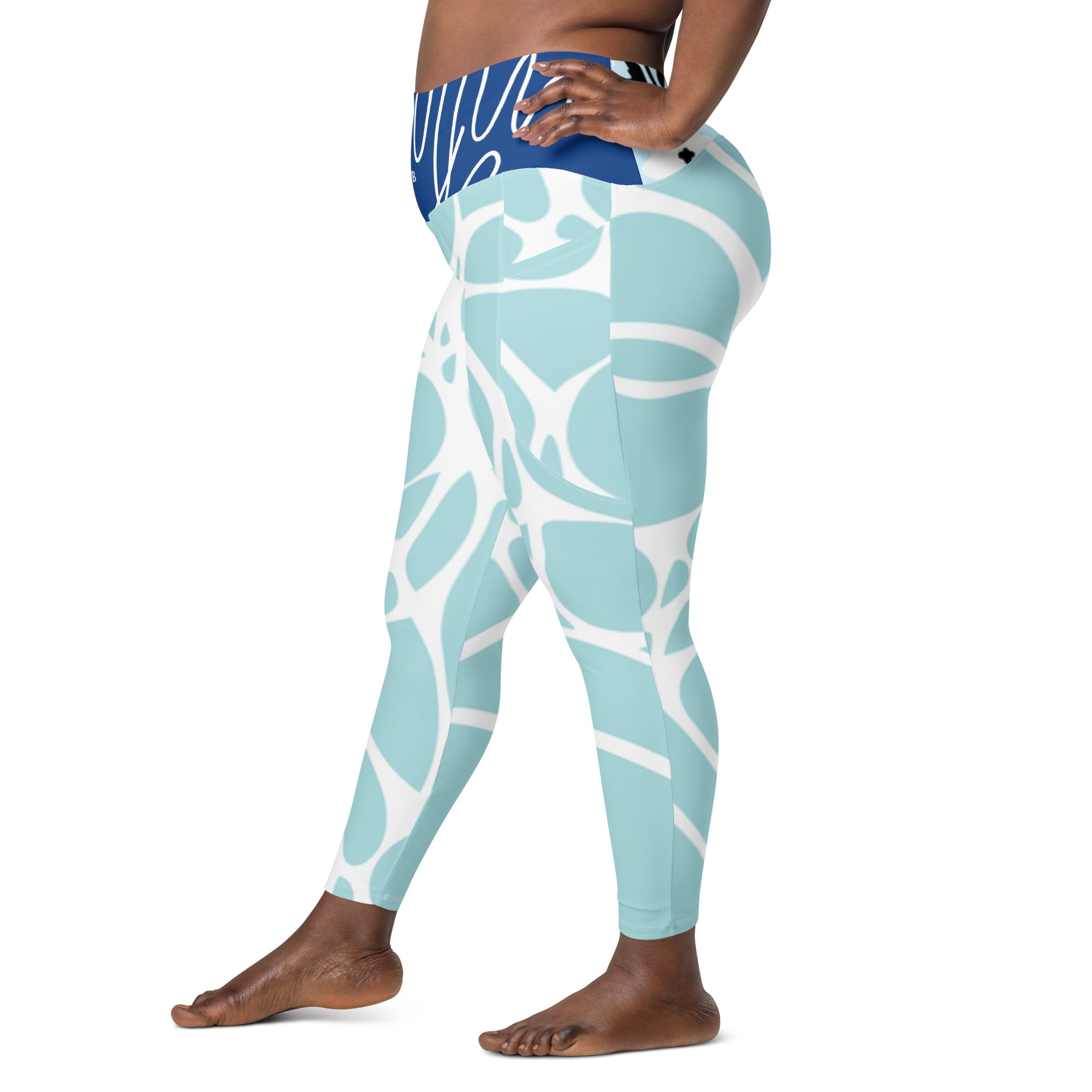 Leggings aqua bleu à poches, gros plan dos, motif abstrait blanc sur jambes