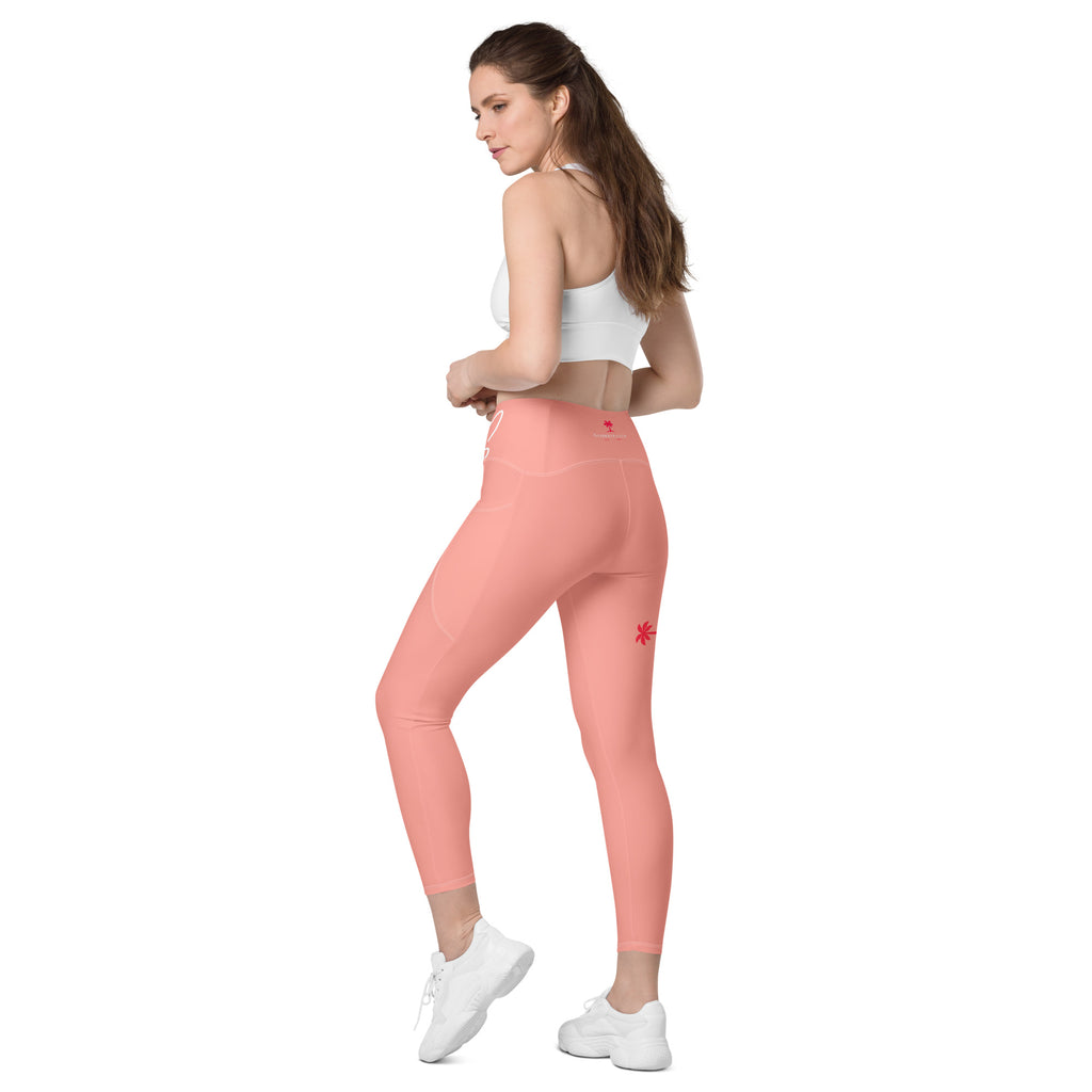Leggings rose 7/8, couture latérale et poches visibles, vue de côté