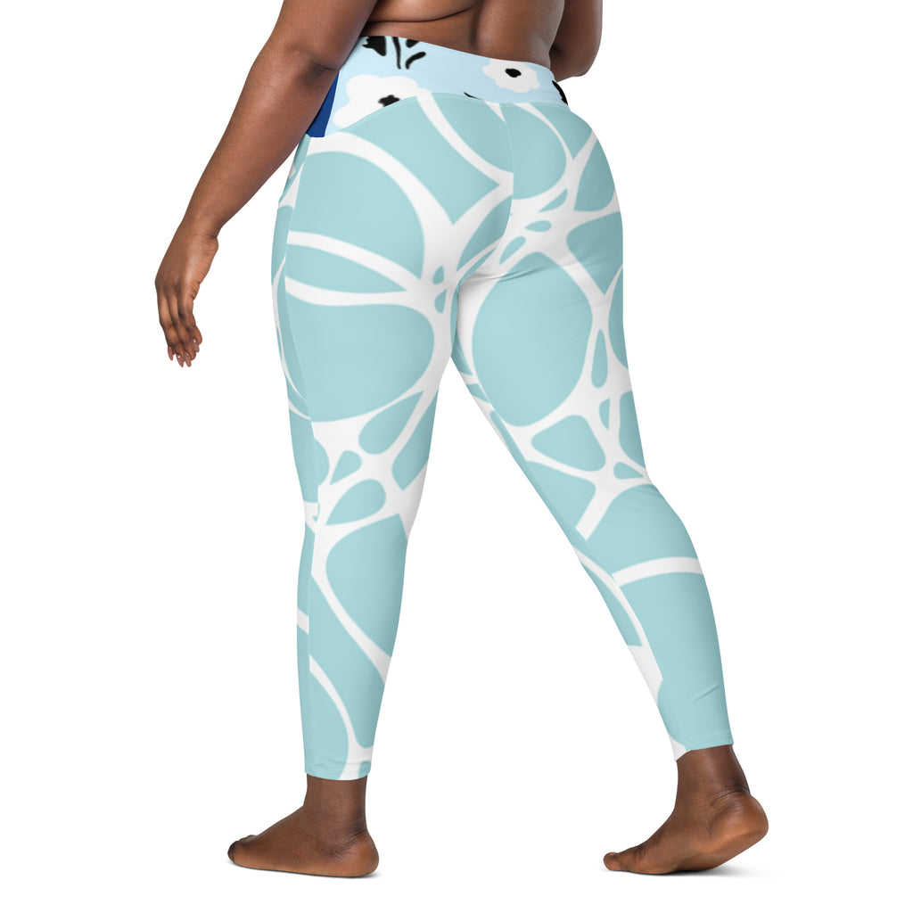 Leggings turquoise à motif abstrait blanc, taille haute, jambes fuselées.