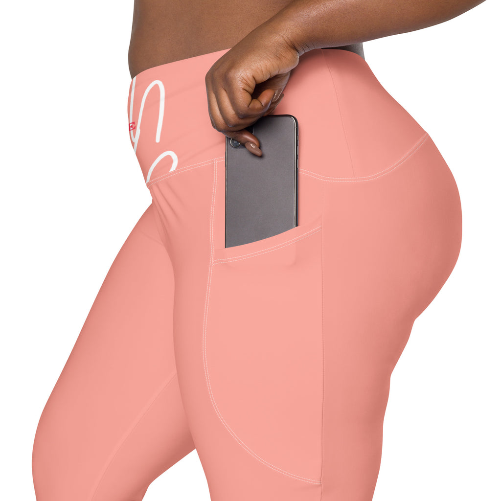 Leggings rose avec poche et surpiqûres, téléphone dans la poche