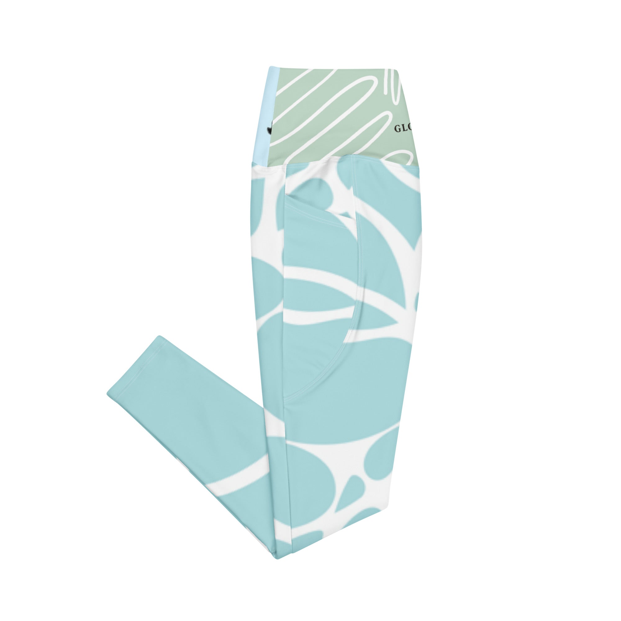 Leggings à poches bleu aqua, motif blanc abstrait sur toute la surface.