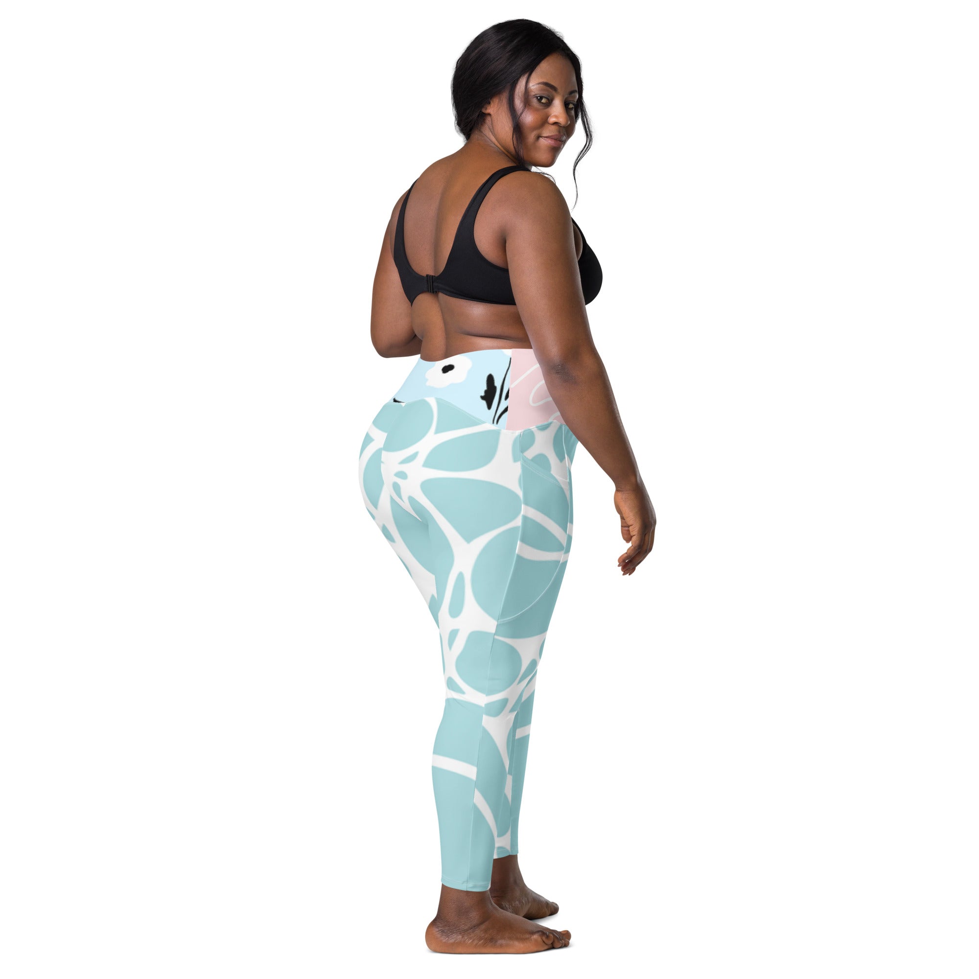 Leggings vert d’eau à motif feuillage blanc, panneau de taille rose clair.