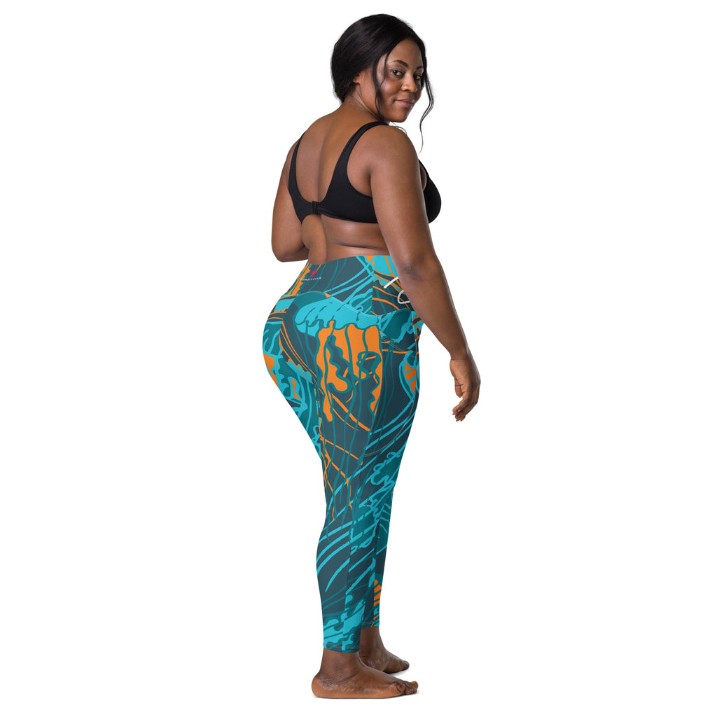 Legging taille haute imprimé bleu turquoise avec motifs abstraits orange, vue de côté.