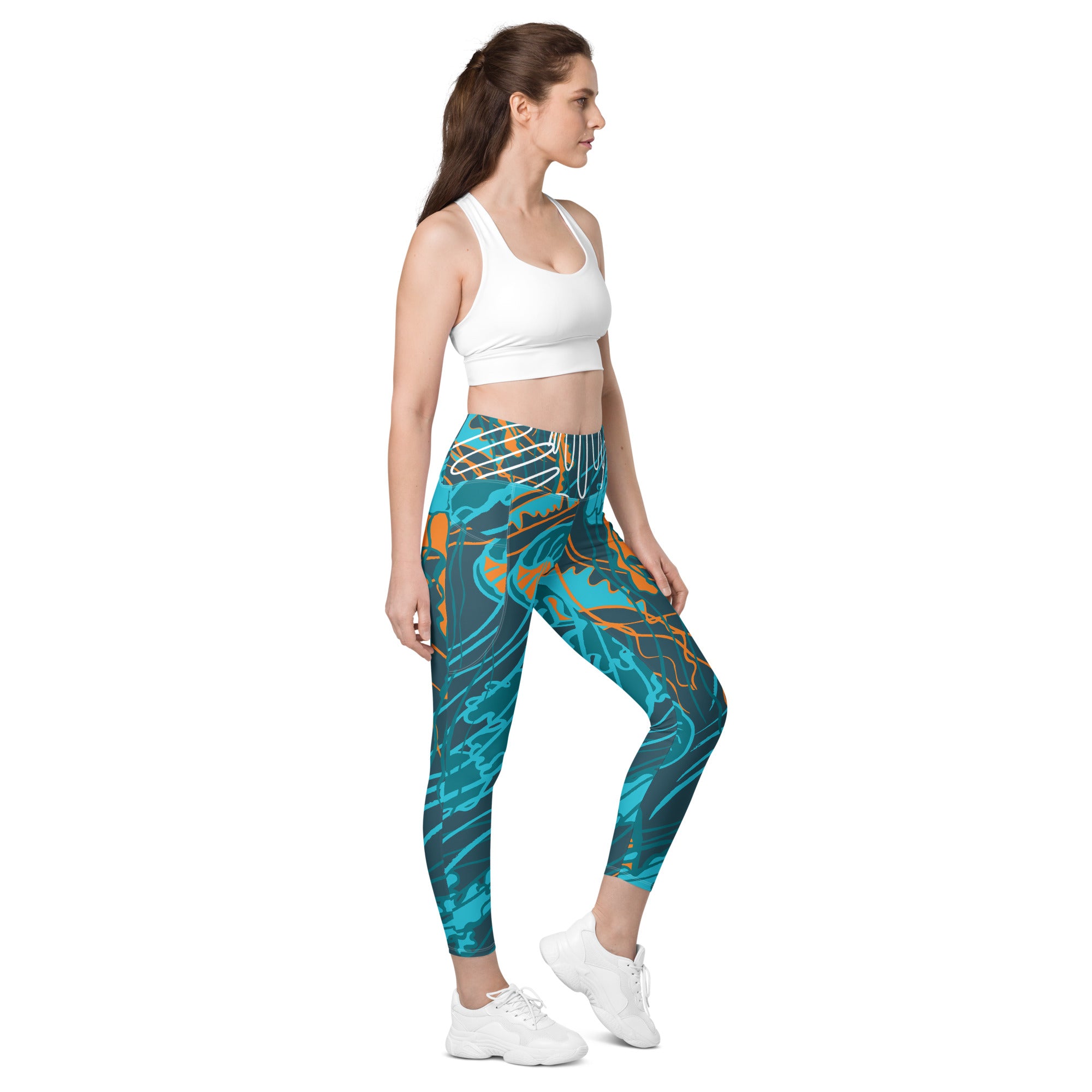 Leggings à poches latérales, bleu turquoise à motif abstrait orange, coupe ajustée