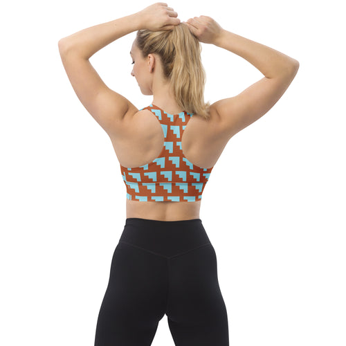Brassière de sport rembourrée motifs géométriques orange et bleu, dos nageur.