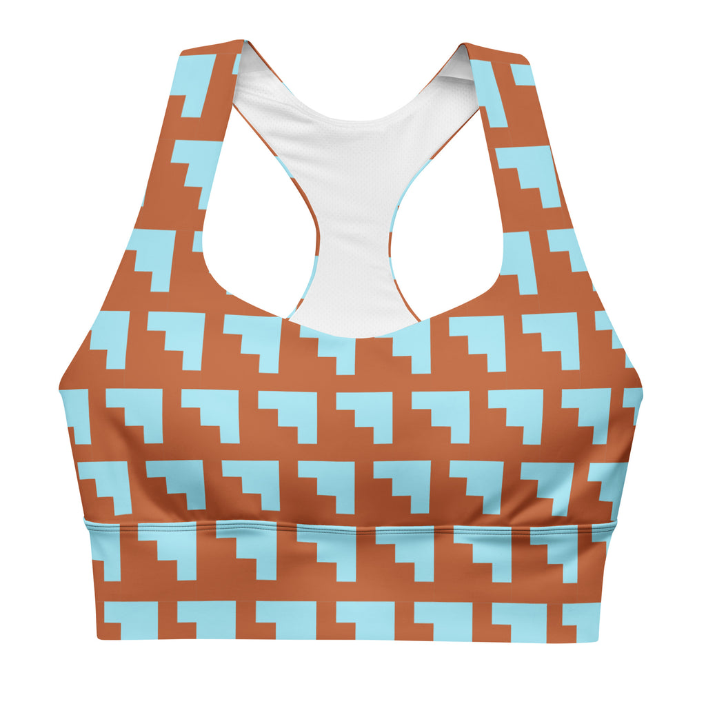 Brassière de sport rembourrée motifs géométriques orange et bleu, bretelles larges.
