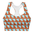Brassière de sport rembourrée motifs géométriques orange et bleu, bretelles larges.