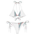Maillot deux-pièces blanc à triangles, bretelles à nouer et bas échancré à liens.