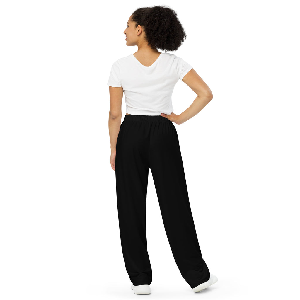 Pantalon large noir à taille élastique, jambe ample, vue de dos.