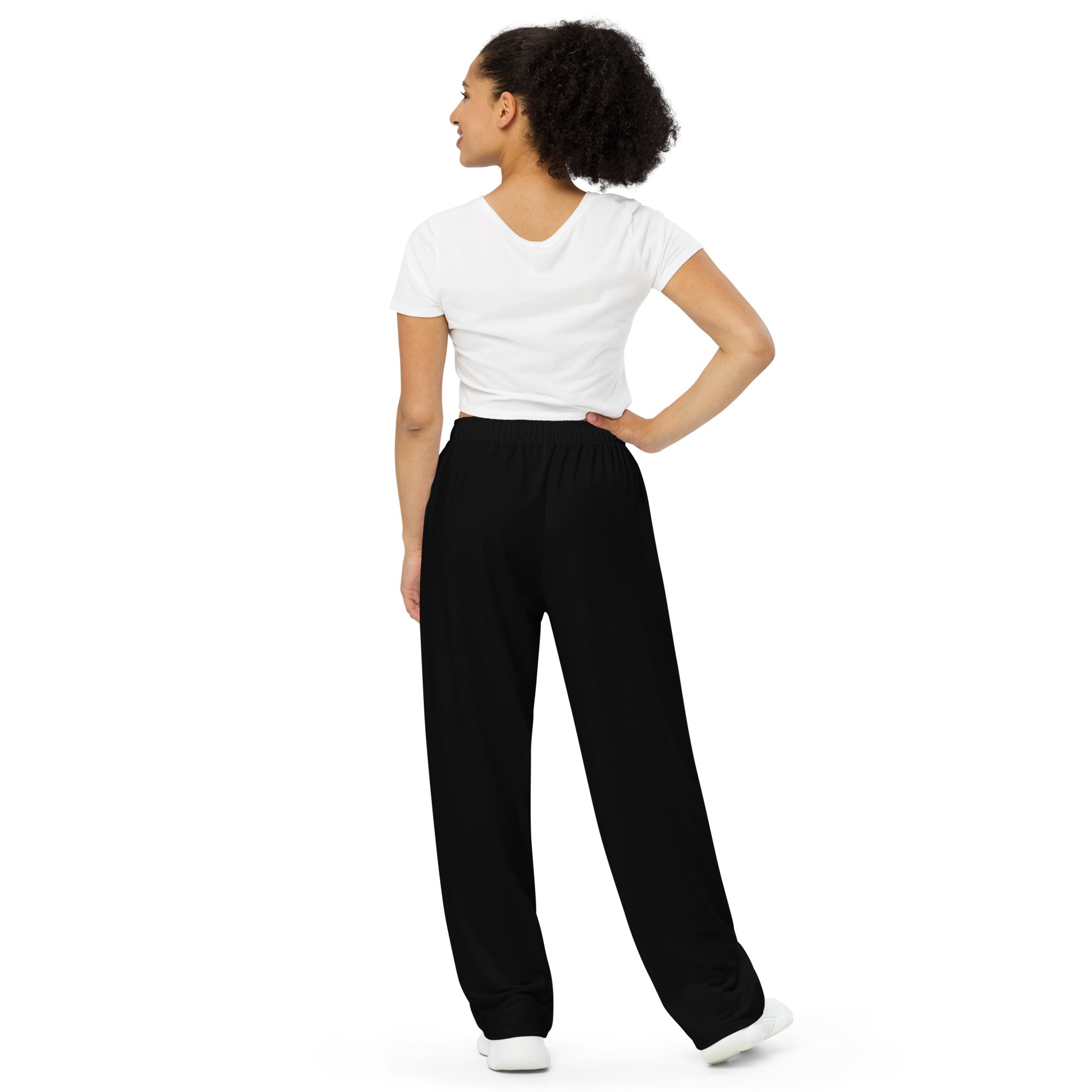 Pantalon large noir à taille élastique, jambe ample, vue de dos.