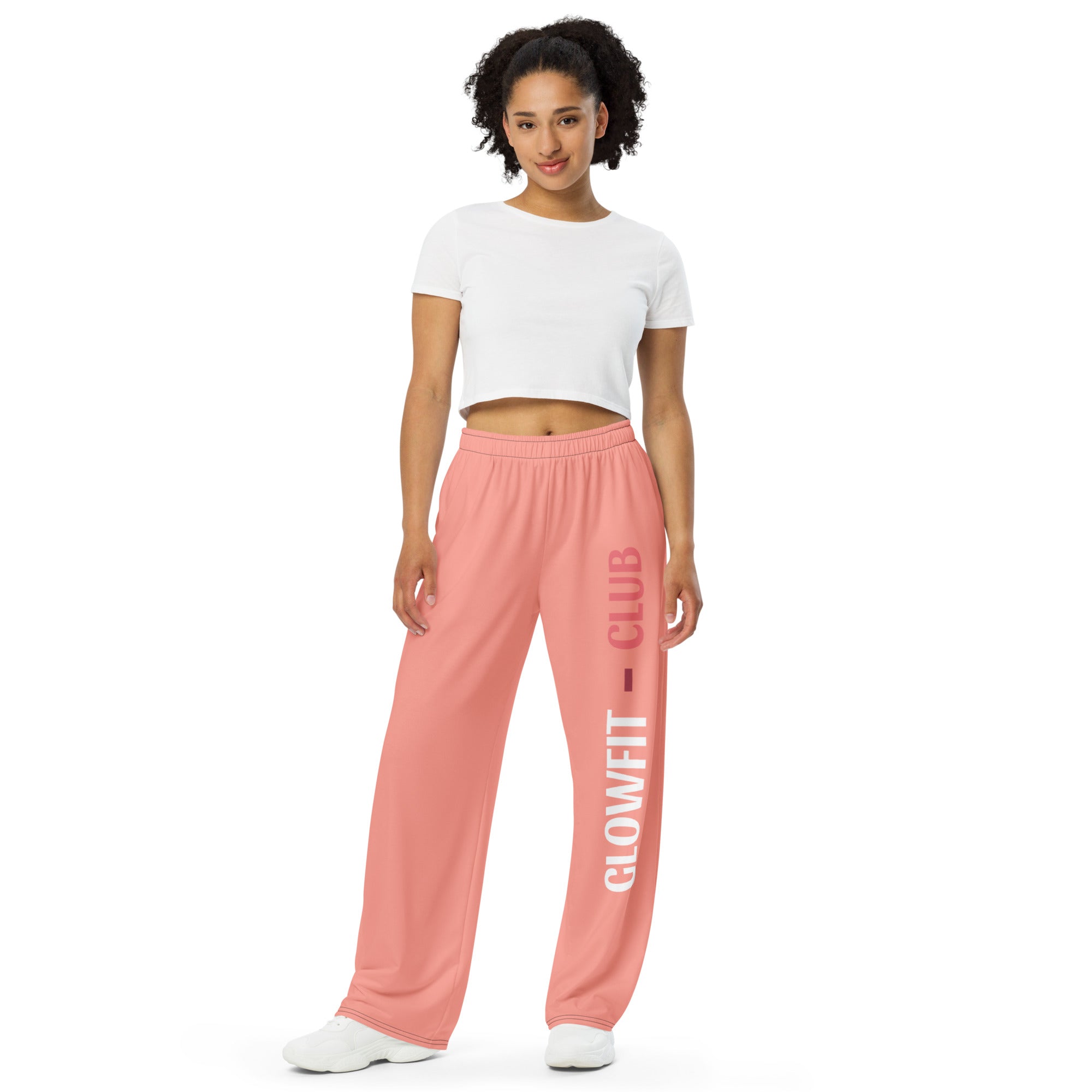 Pantalon large rose à jambes longues, taille élastique, logo GLOWFIT-CLUB sur la jambe.