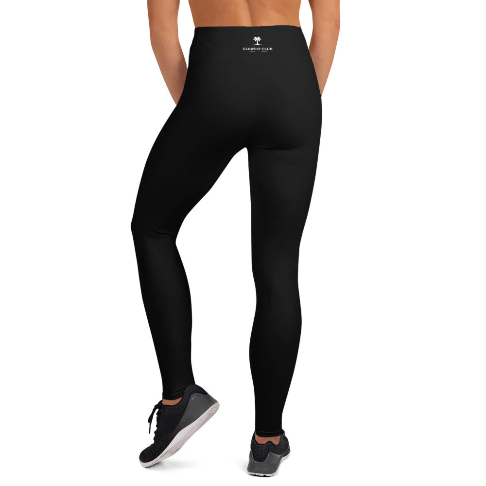 Legging noir taille haute, vue arrière, silhouette galbée, jusqu’aux chevilles.