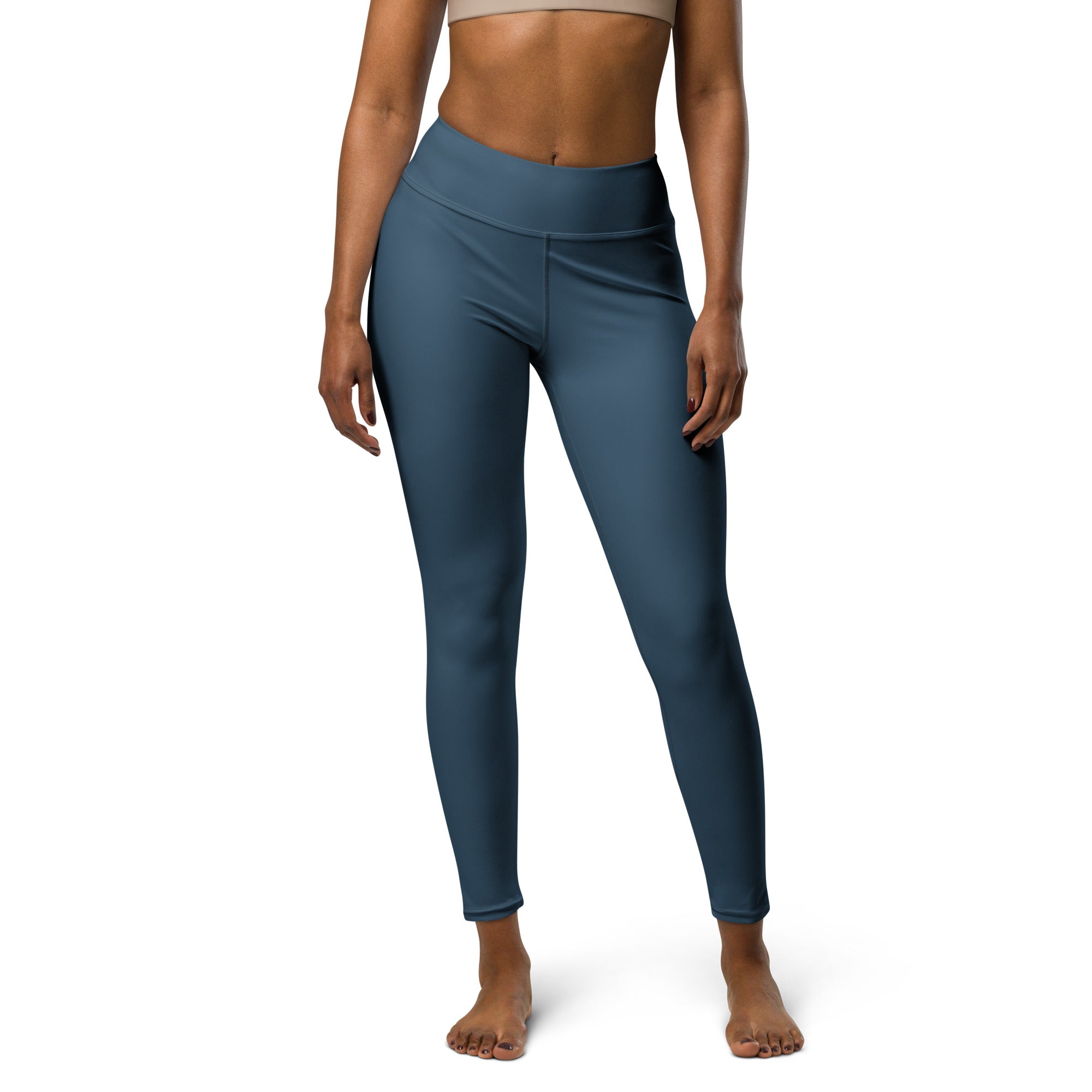Legging bleu foncé taille haute, panneau avant plat et coutures latérales.