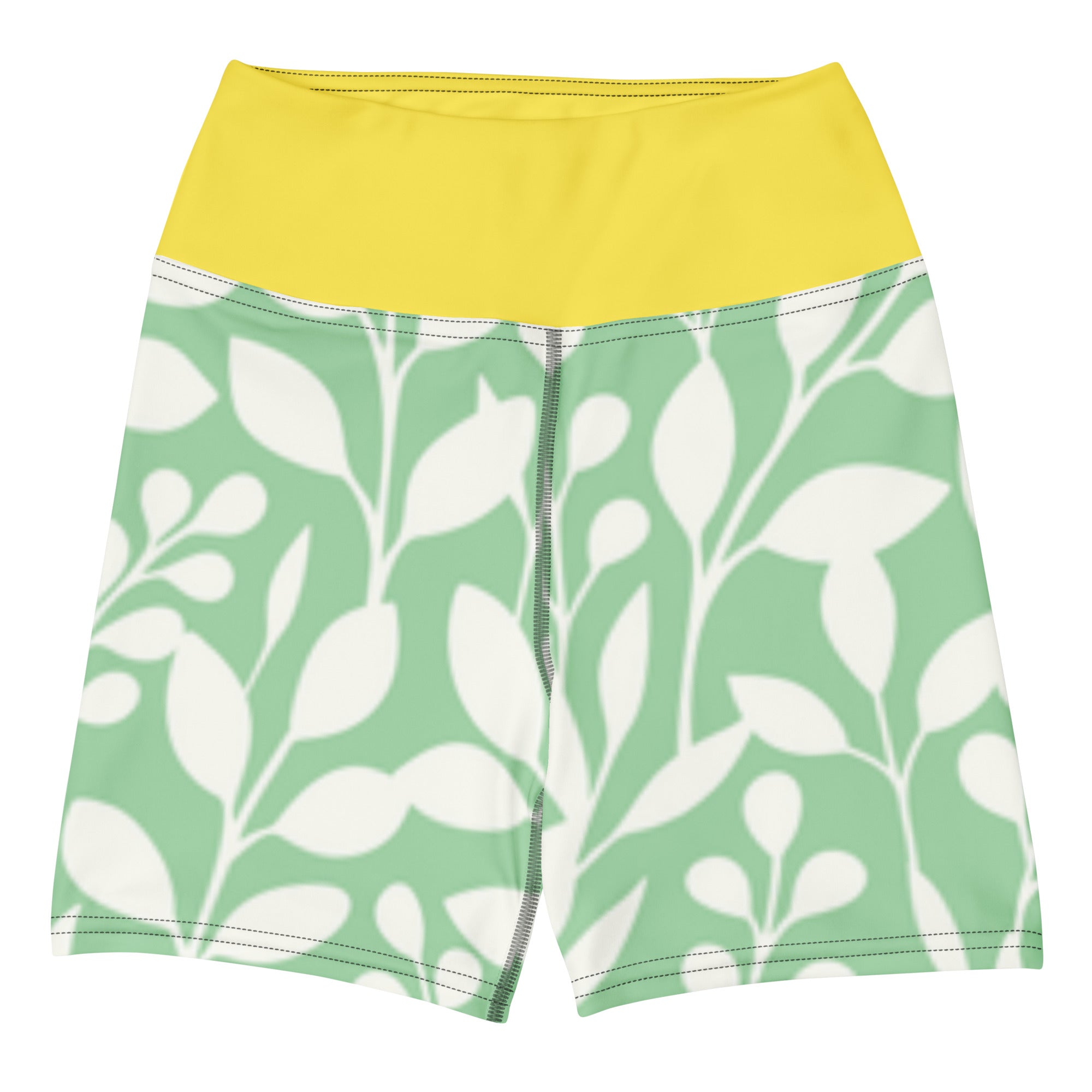 Short de fitness vert à imprimé feuilles blanches, taille jaune, fermeture zippée au centre.