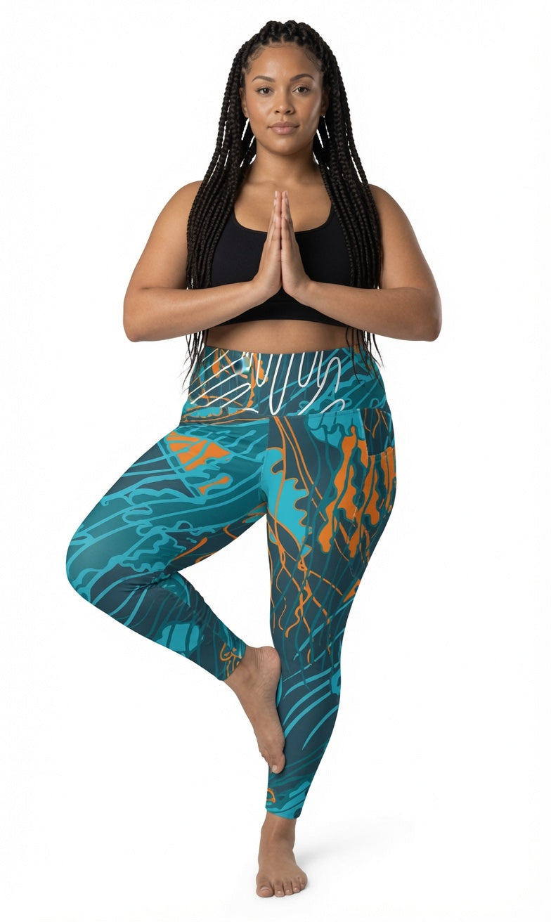 Legging taille haute imprimé bleu turquoise et orange, vue de face sur pied.