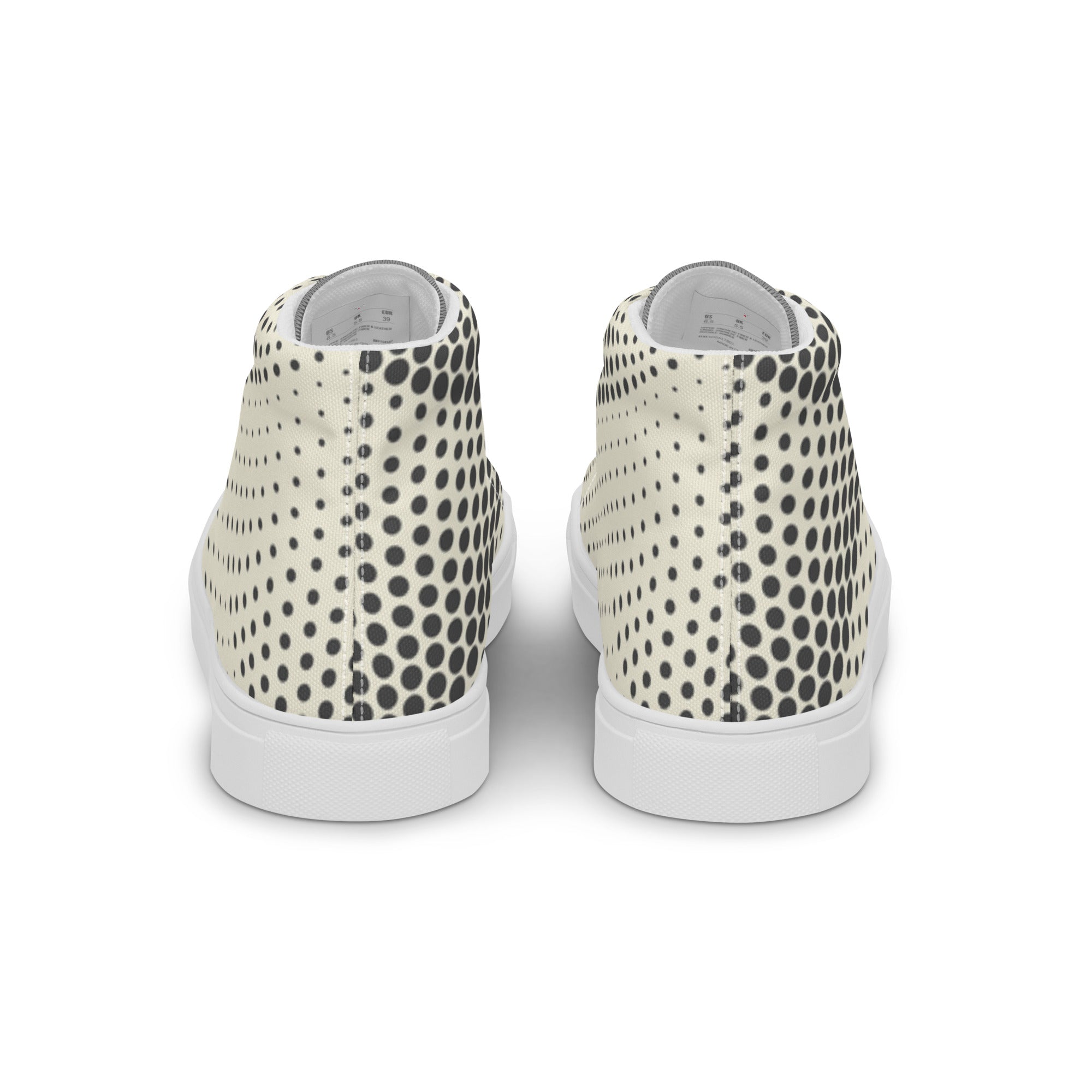 Paires de baskets hautes en toile crème à pois noirs, talon blanc.