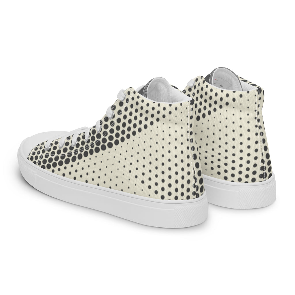 Baskets hautes en toile crème à pois noirs, côté arrière et semelle blanche.